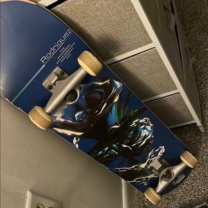 Blue Skateboard with Artistic Design